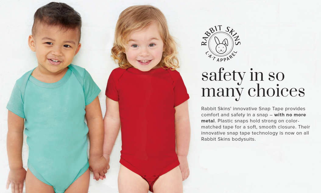 an add for toddler bodysuits, two toddlers holding hands